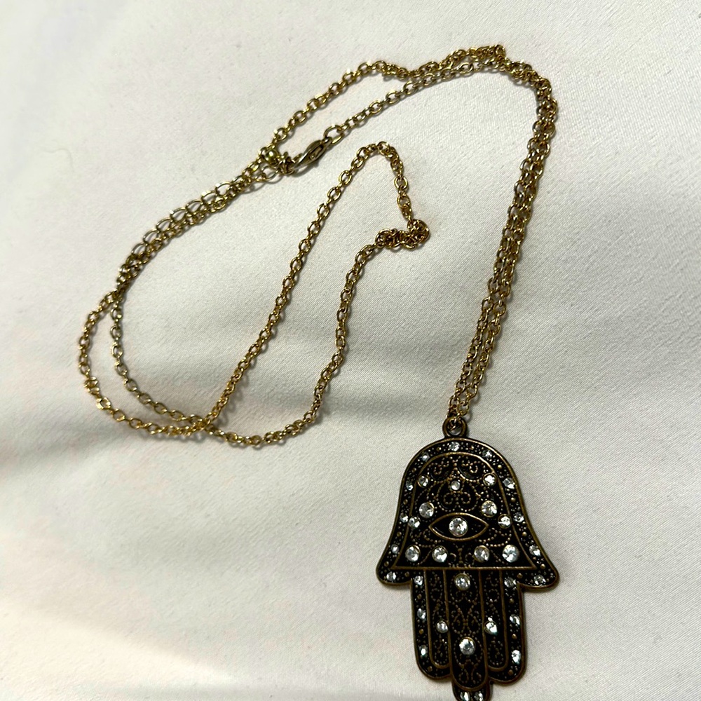 Charming Charlie bronze Hamsah evil eye on long gold chain necklace
